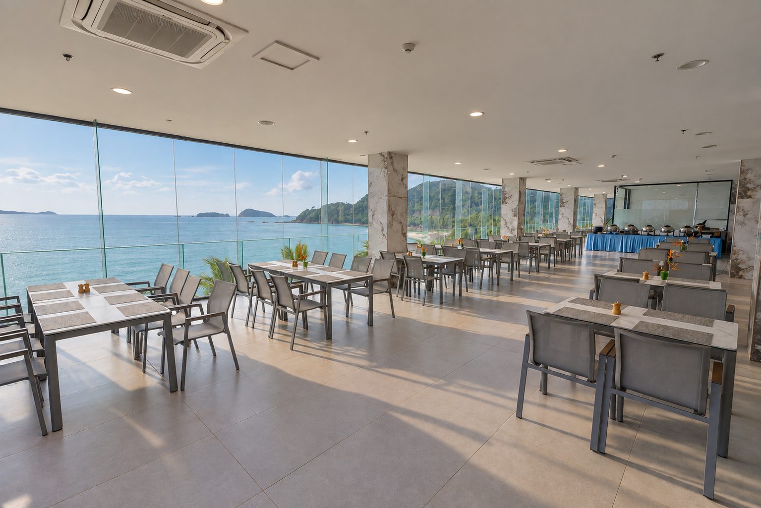 Aurora dining room with floor-to-ceiling sea views