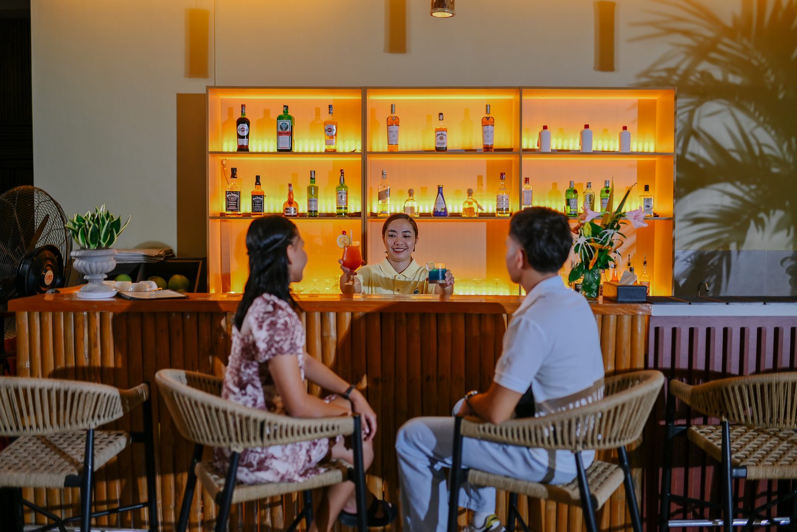 Guests at the backlit bar at Briza