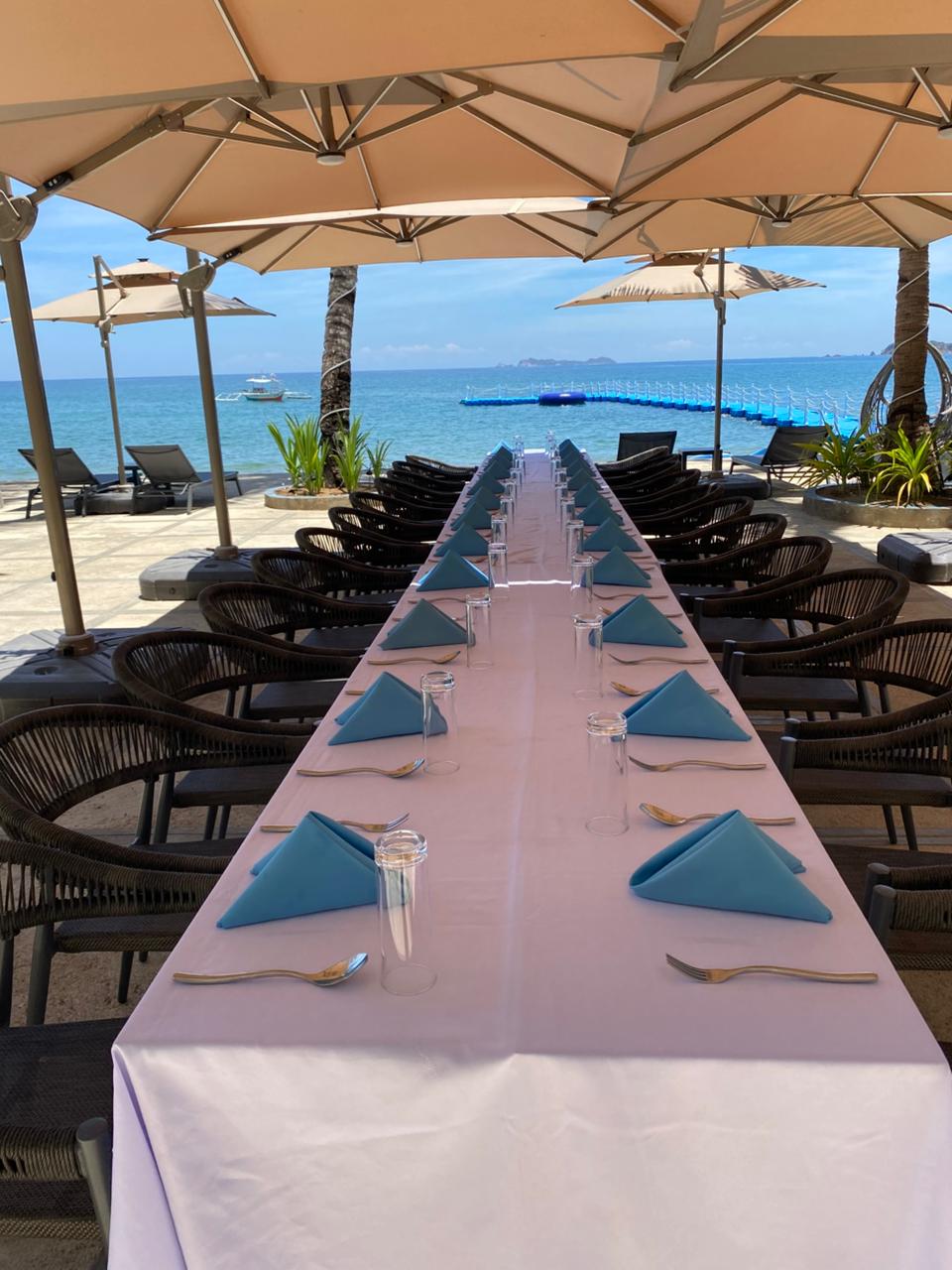 Seaside banquet table set for a celebration