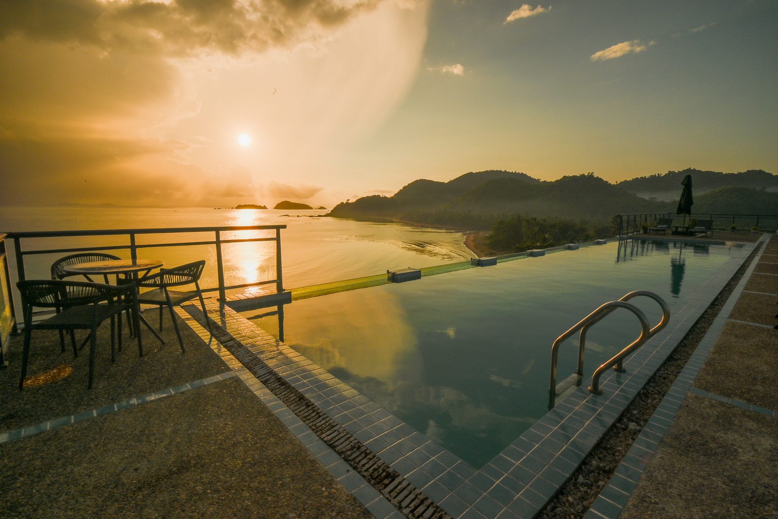 Rooftop infinity pool at sunrise