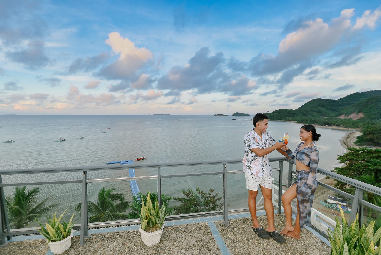Guests on the rooftop overlooking the bay